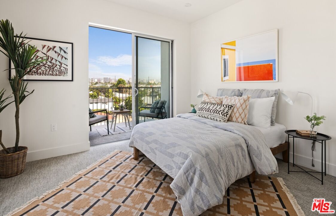 2600 South Sepulveda Boulevard, Unit 407 Los Angeles, CA 90064 - Photo 13 of 33 a bedroom with a bed and a desk