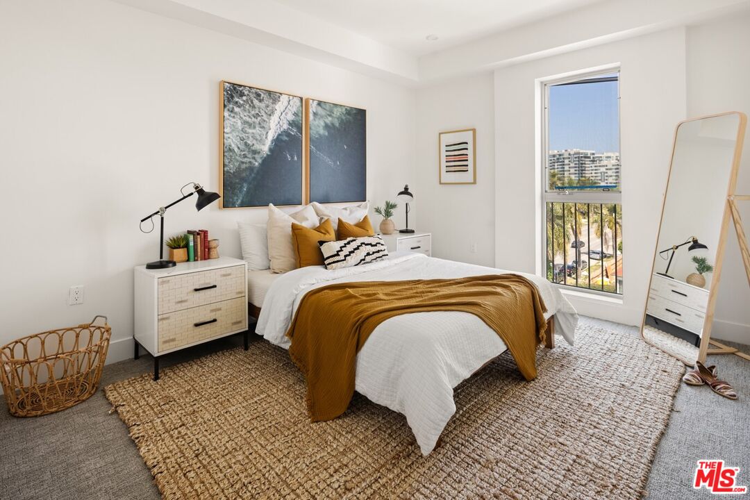 2600 South Sepulveda Boulevard, Unit 407 Los Angeles, CA 90064 - Photo 10 of 33 a bedroom with a bed and a couch
