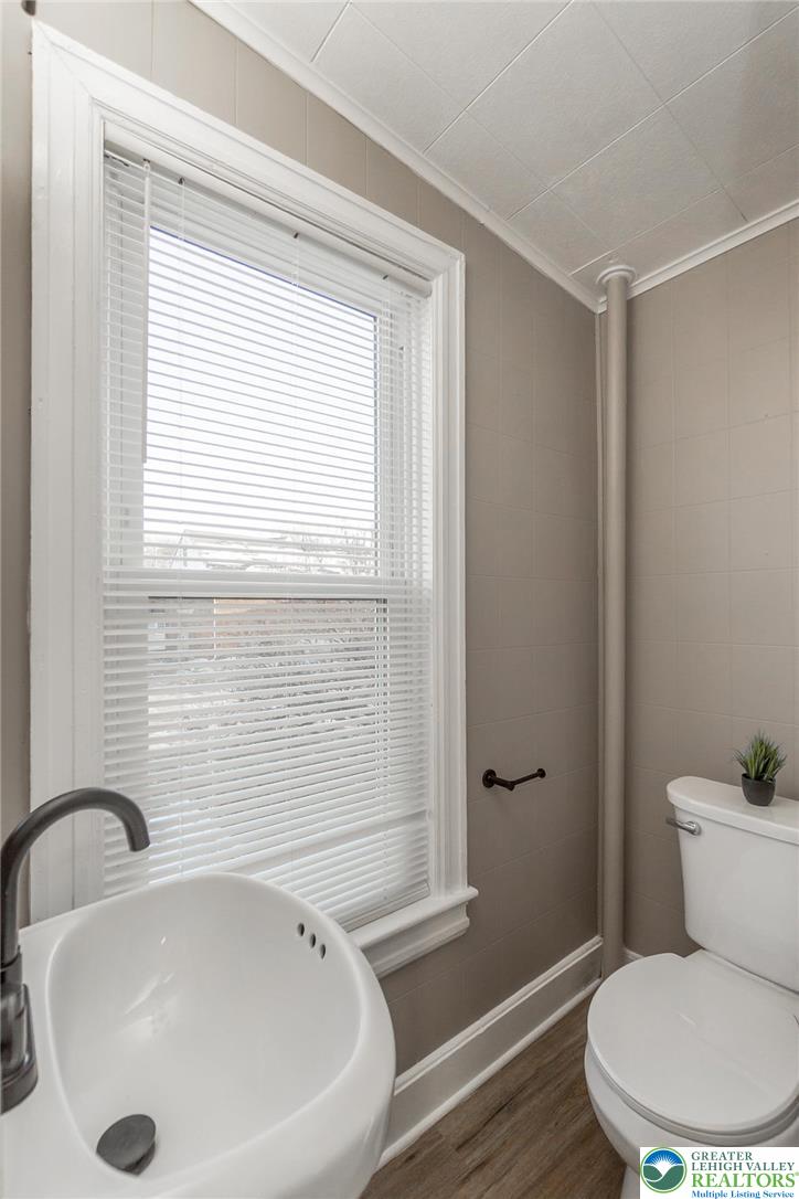 2213 Village Road Orefield, PA 18069 - Photo 16 of 41 a bathroom with a sink and a toilet