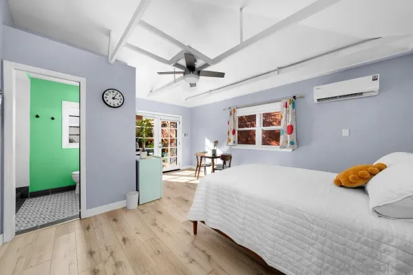 a bedroom with a bed and a window