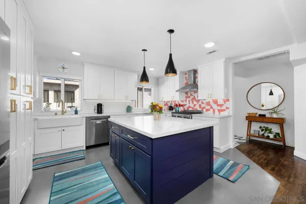 a kitchen with a sink and cabinets