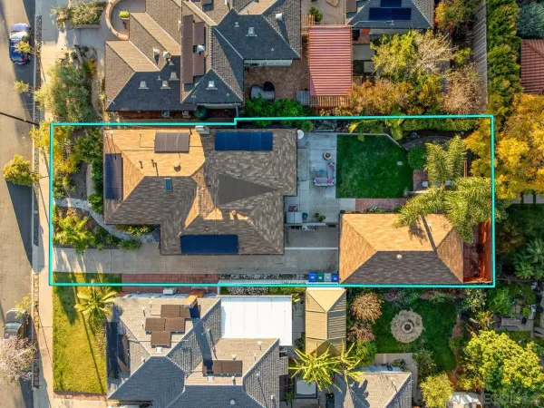 an aerial view of houses with yard