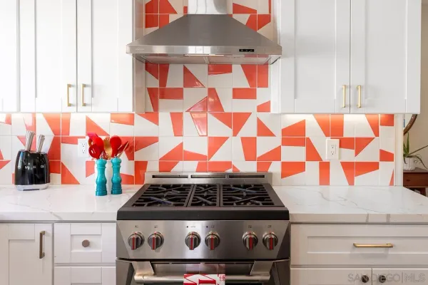 a stove top oven sitting inside of a kitchen