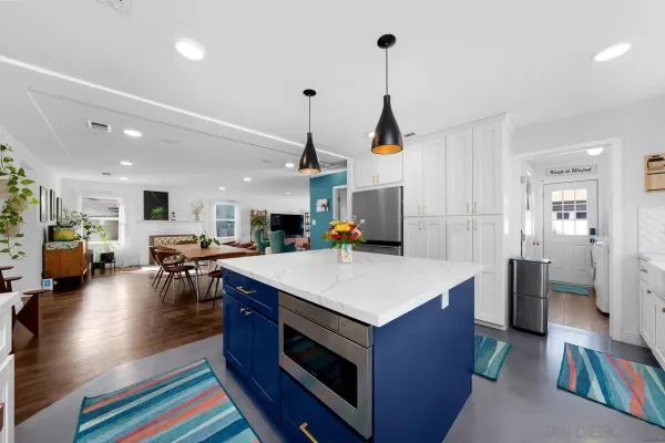 a view of kitchen island with furniture and wooden floor