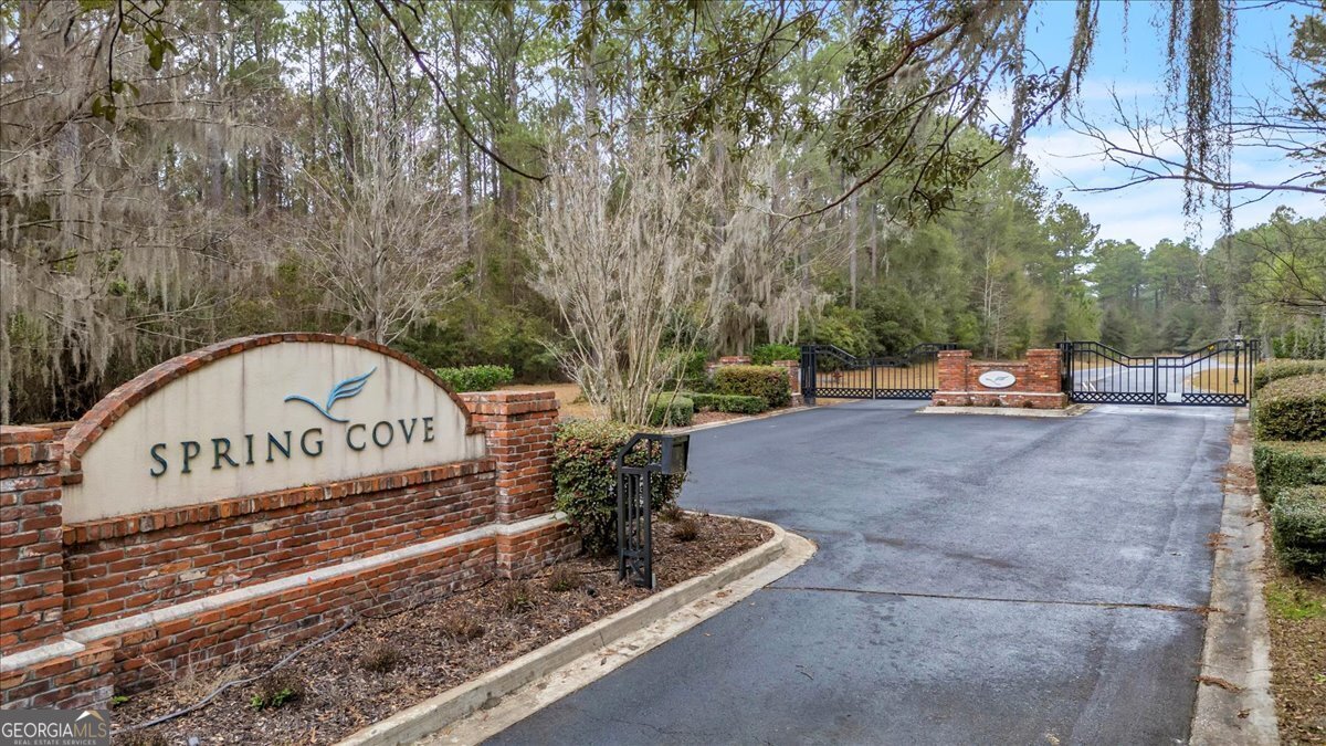 Lot 83 Fiddlers Cove Townsend, GA 31331 - Photo 3 of 16 a view of outdoor space with signage and flags
