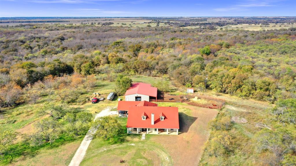 14771 Shearer Road Pilot Point, TX 76258 - Photo 18 of 36 an aerial view of residential houses with outdoor space and trees