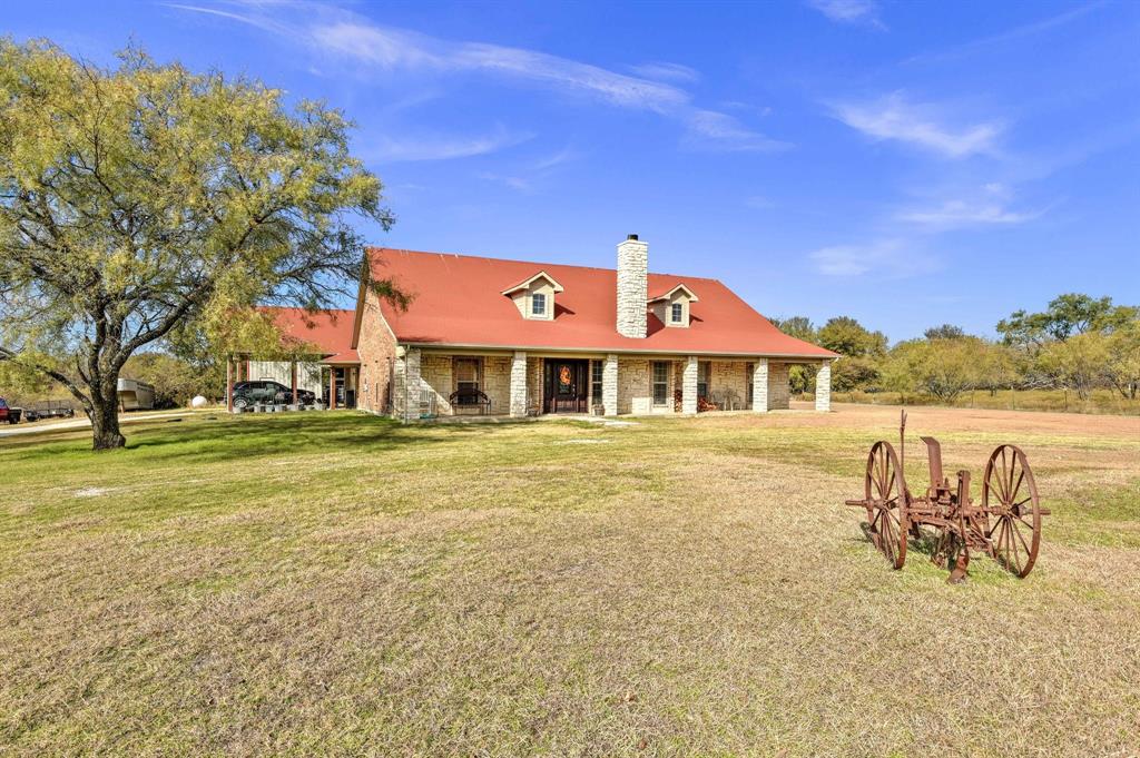 14771 Shearer Road Pilot Point, TX 76258 - Photo 25 of 36 a front view of house with outdoor space and swimming pool