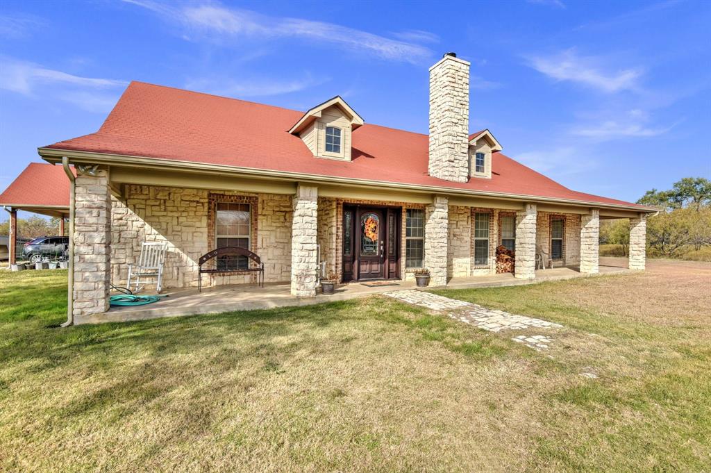 14771 Shearer Road Pilot Point, TX 76258 - Photo 27 of 36 a front view of a house with a yard