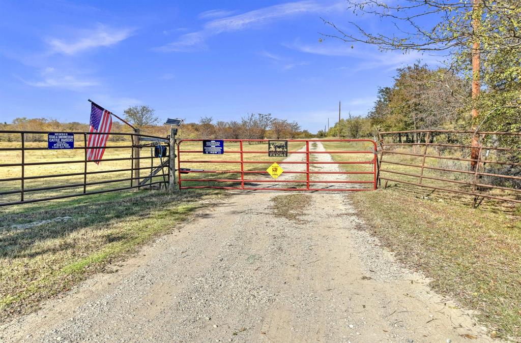 14771 Shearer Road Pilot Point, TX 76258 - Photo 32 of 36 a view of a yard with wooden fence