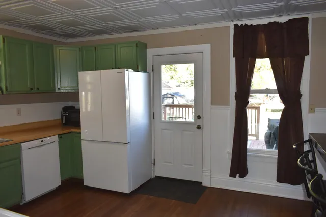 a kitchen with a table and chairs