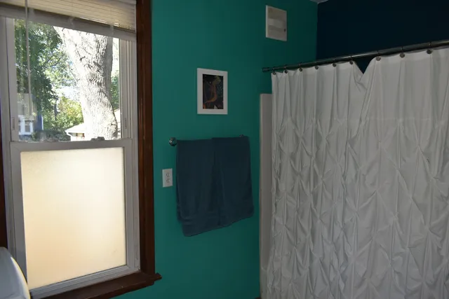 a bedroom with a bed and a table