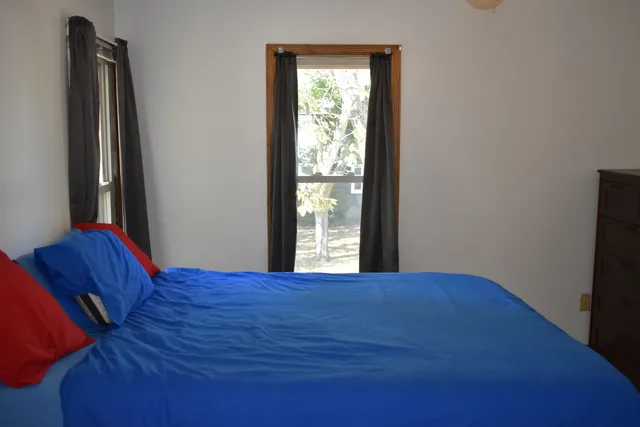 a view of an empty room and wooden floor