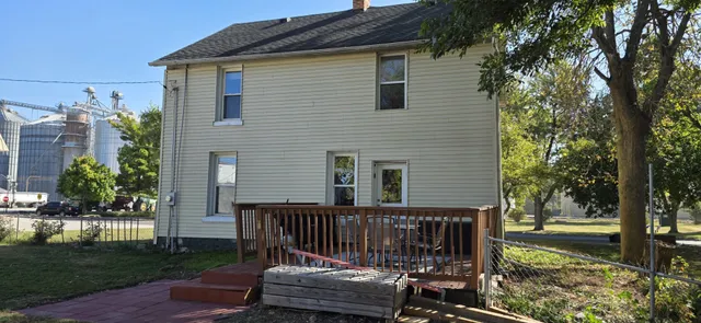 a view of a chairs and table in the patio