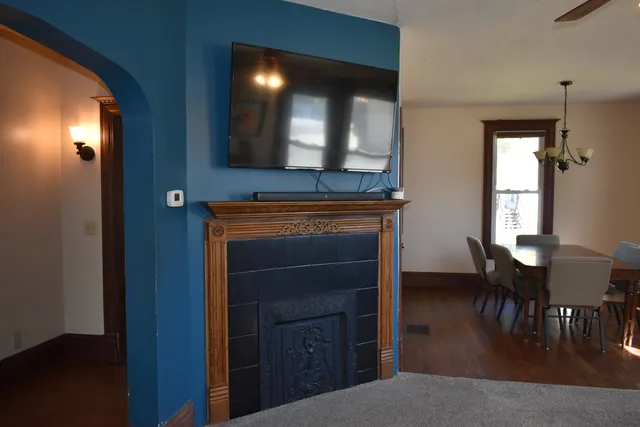 a living room with furniture and a ceiling fan