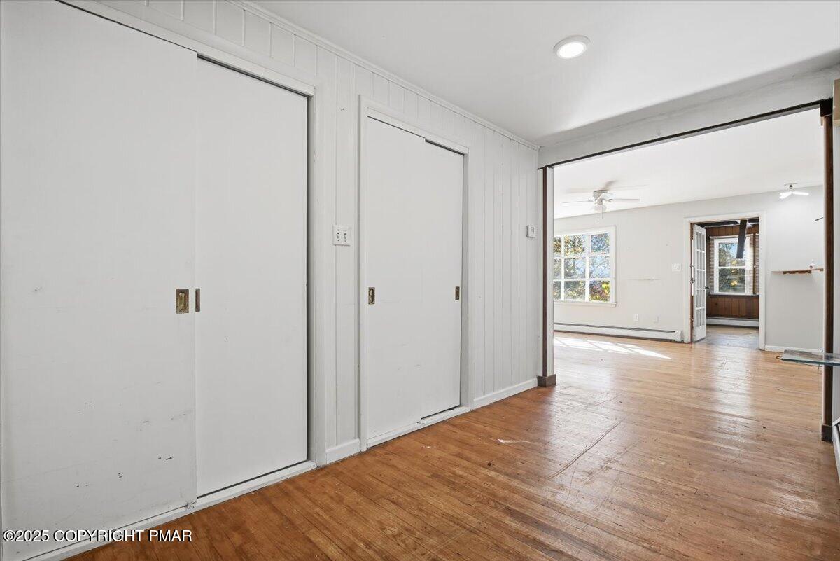 137 Berwick Heights Road East Stroudsburg, PA 18301 - Photo 15 of 88 a view of an empty room with wooden floor and a window