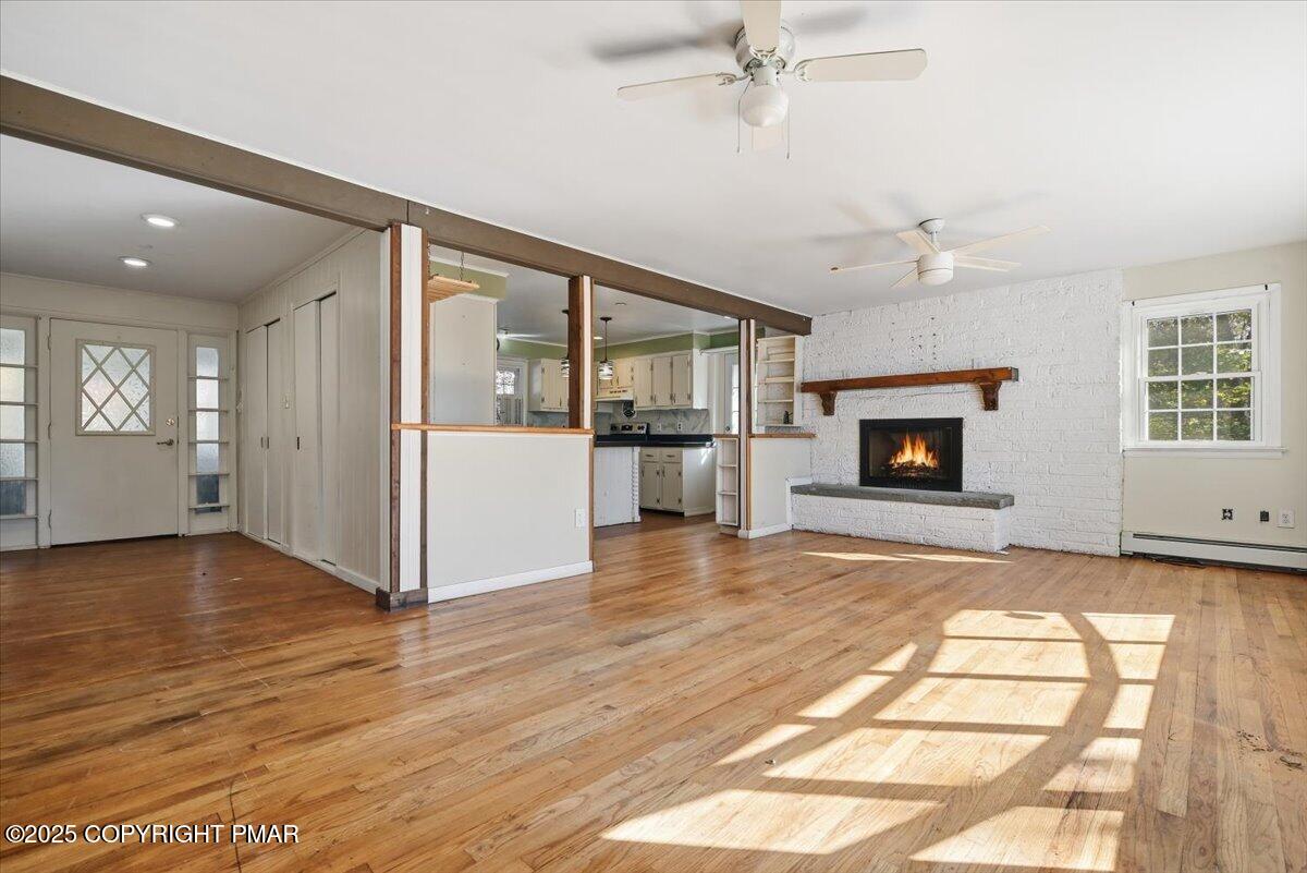137 Berwick Heights Road East Stroudsburg, PA 18301 - Photo 20 of 88 a view of empty room with wooden floor and fireplace
