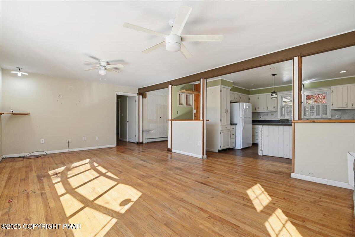 137 Berwick Heights Road East Stroudsburg, PA 18301 - Photo 21 of 88 a view of a big room with wooden floor and a kitchen