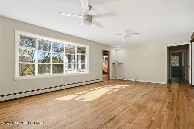 a kitchen with kitchen island granite countertop a sink a counter space appliances and cabinets