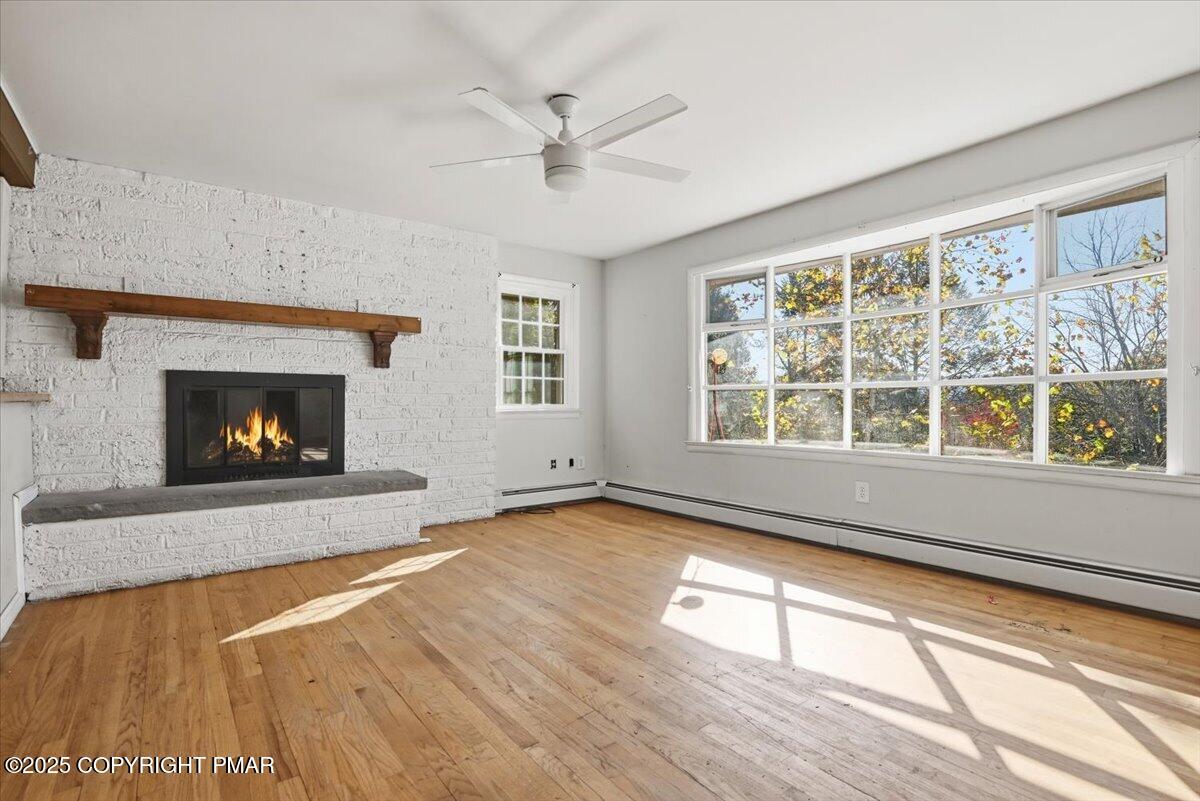 137 Berwick Heights Road East Stroudsburg, PA 18301 - Photo 24 of 88 a view of an empty room with wooden floor and a window
