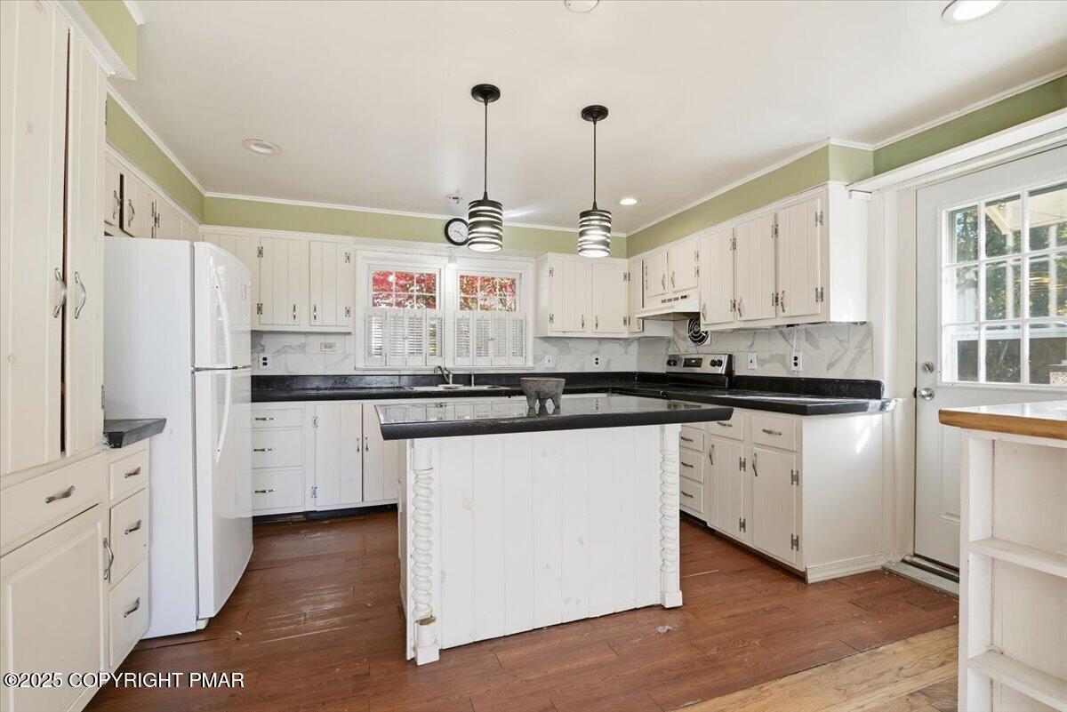 137 Berwick Heights Road East Stroudsburg, PA 18301 - Photo 25 of 88 a kitchen with stainless steel appliances kitchen island granite countertop a stove a sink and white cabinets