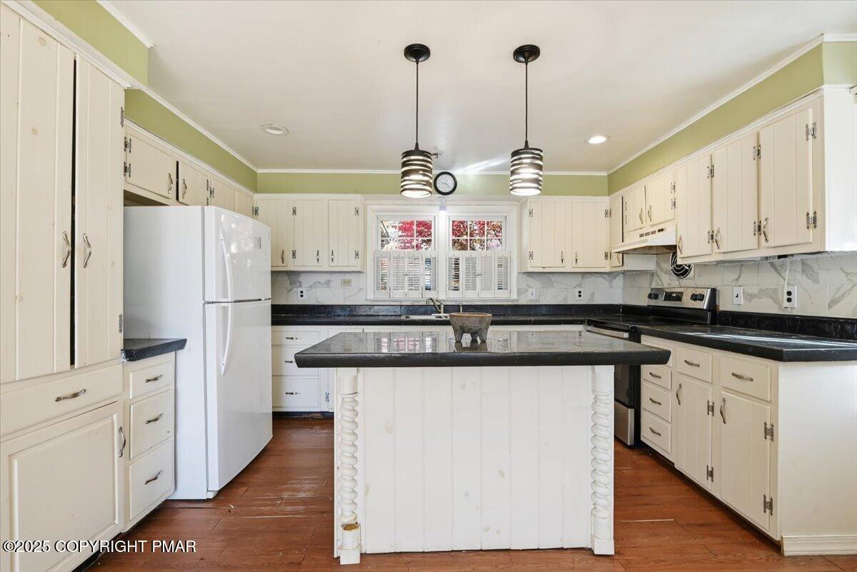 137 Berwick Heights Road East Stroudsburg, PA 18301 - Photo 26 of 88 a kitchen with kitchen island granite countertop a sink a counter space appliances and cabinets