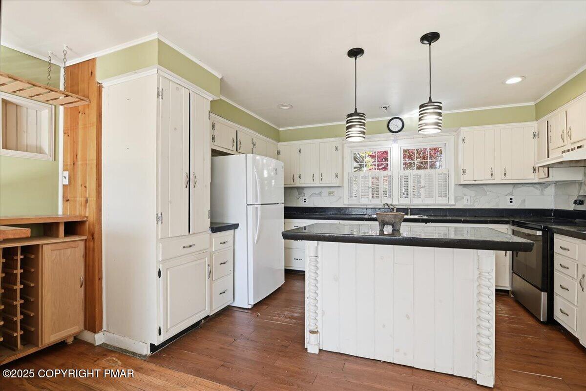 137 Berwick Heights Road East Stroudsburg, PA 18301 - Photo 27 of 88 a kitchen with stainless steel appliances kitchen island granite countertop a refrigerator a sink and white cabinets
