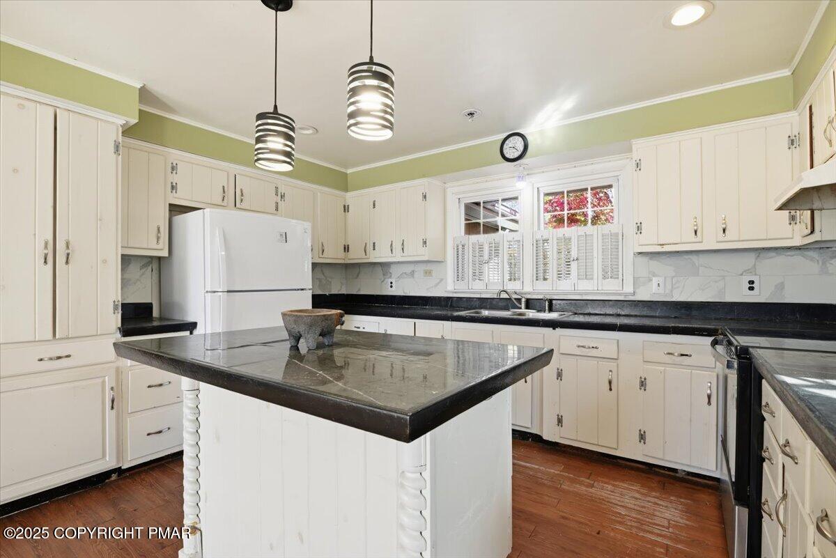137 Berwick Heights Road East Stroudsburg, PA 18301 - Photo 28 of 88 a kitchen that has a lot of cabinets in it and wooden floors