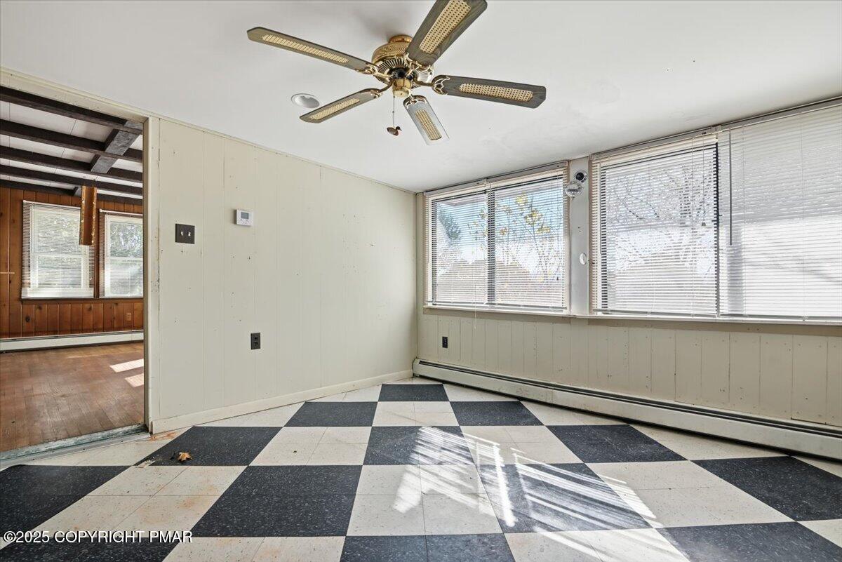 137 Berwick Heights Road East Stroudsburg, PA 18301 - Photo 35 of 88 a room with a black white checkered floor with a large window and outside view