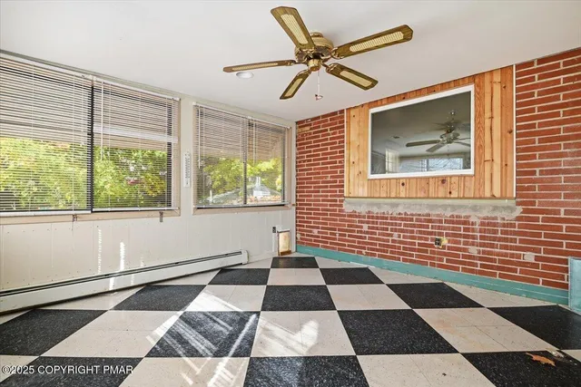 a view of an empty room with a fireplace