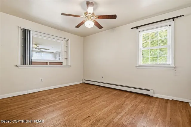 a view of an empty room with a flat screen tv