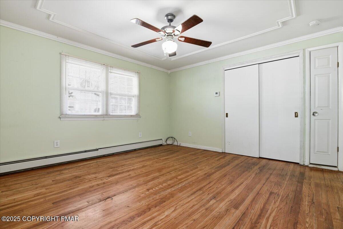 137 Berwick Heights Road East Stroudsburg, PA 18301 - Photo 42 of 88 wooden floor in an empty room with a window