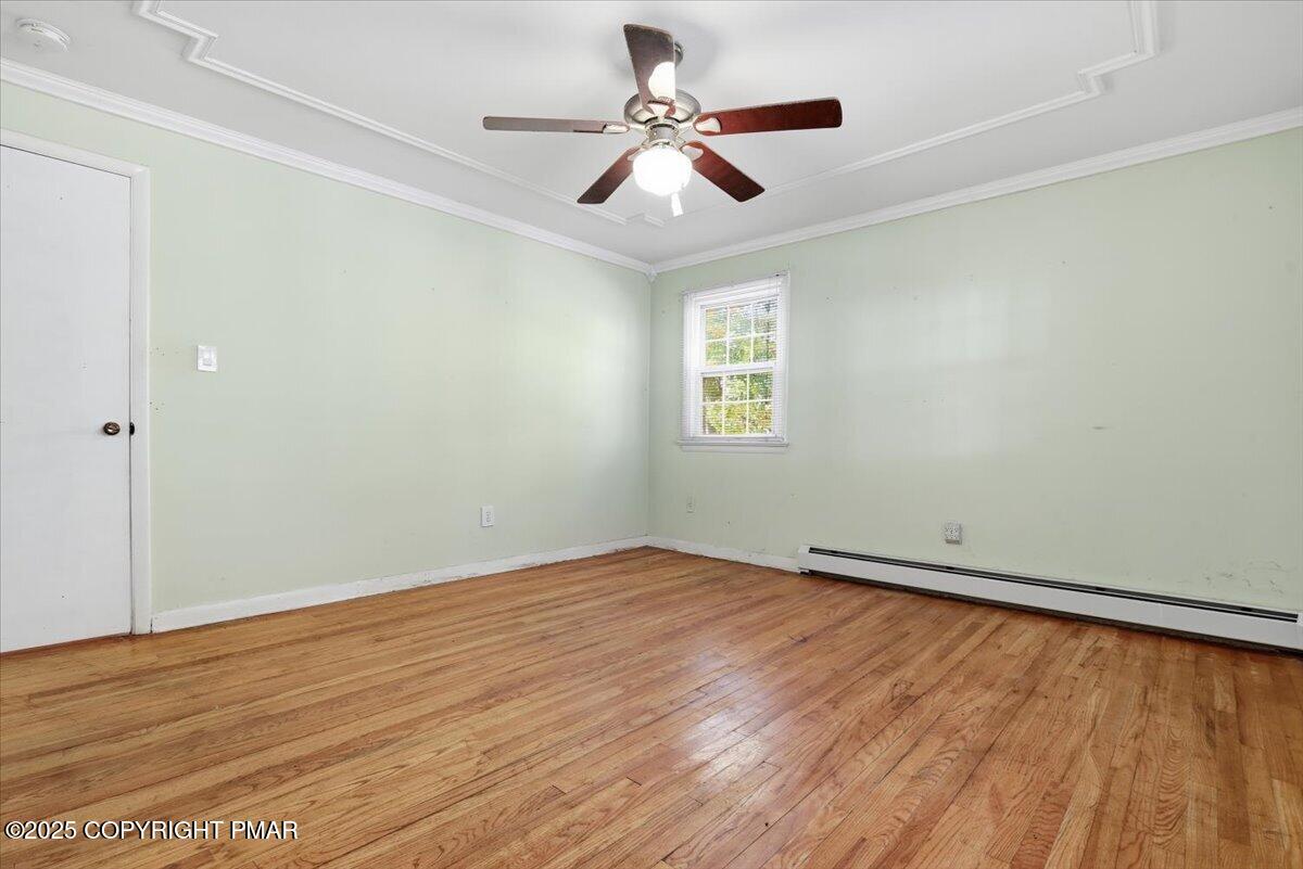 137 Berwick Heights Road East Stroudsburg, PA 18301 - Photo 43 of 88 wooden floor in an empty room with a window