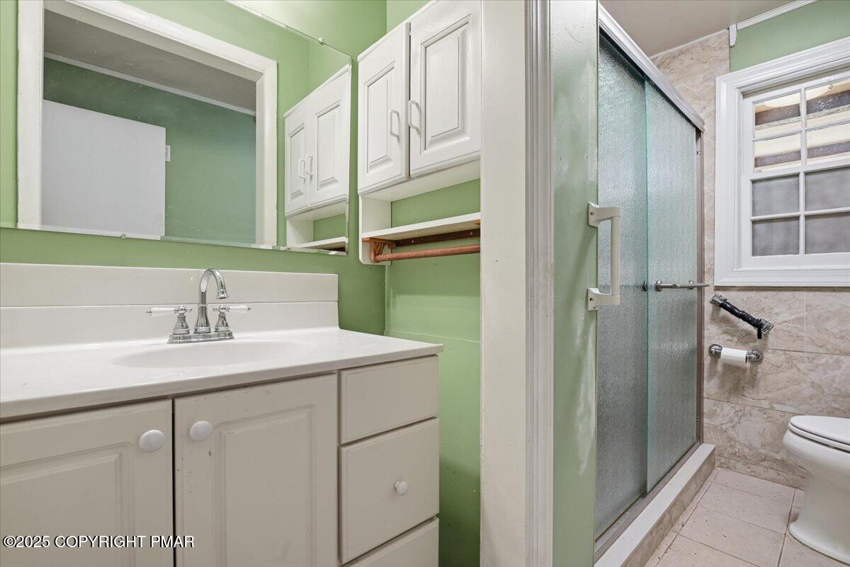 137 Berwick Heights Road East Stroudsburg, PA 18301 - Photo 44 of 88 a bathroom with a sink and a mirror