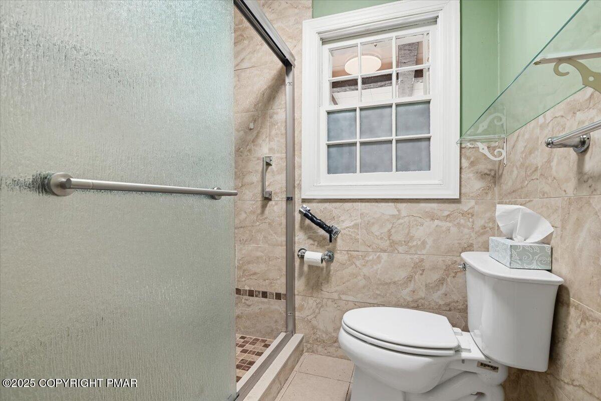 137 Berwick Heights Road East Stroudsburg, PA 18301 - Photo 45 of 88 a bathroom with a toilet and a shower