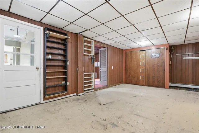 a view of a room with wooden walls
