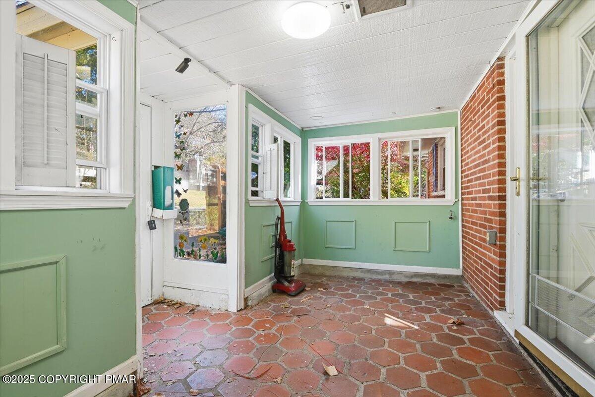 137 Berwick Heights Road East Stroudsburg, PA 18301 - Photo 5 of 88 a view of an empty room with a birdcage and a window