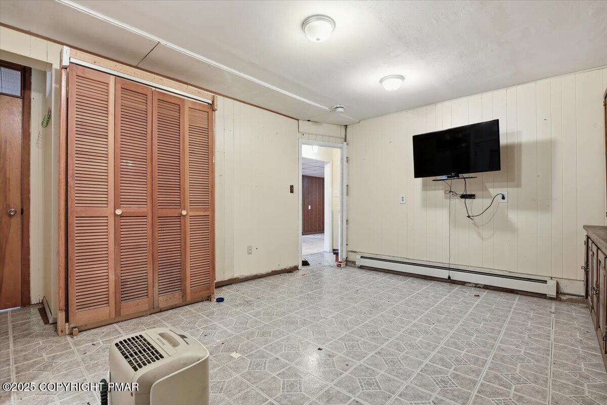 137 Berwick Heights Road East Stroudsburg, PA 18301 - Photo 54 of 88 a view of an empty room with a flat screen tv