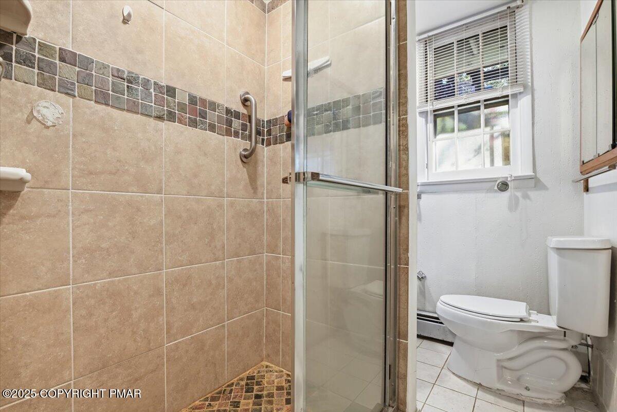 137 Berwick Heights Road East Stroudsburg, PA 18301 - Photo 58 of 88 a bathroom with a toilet and a shower