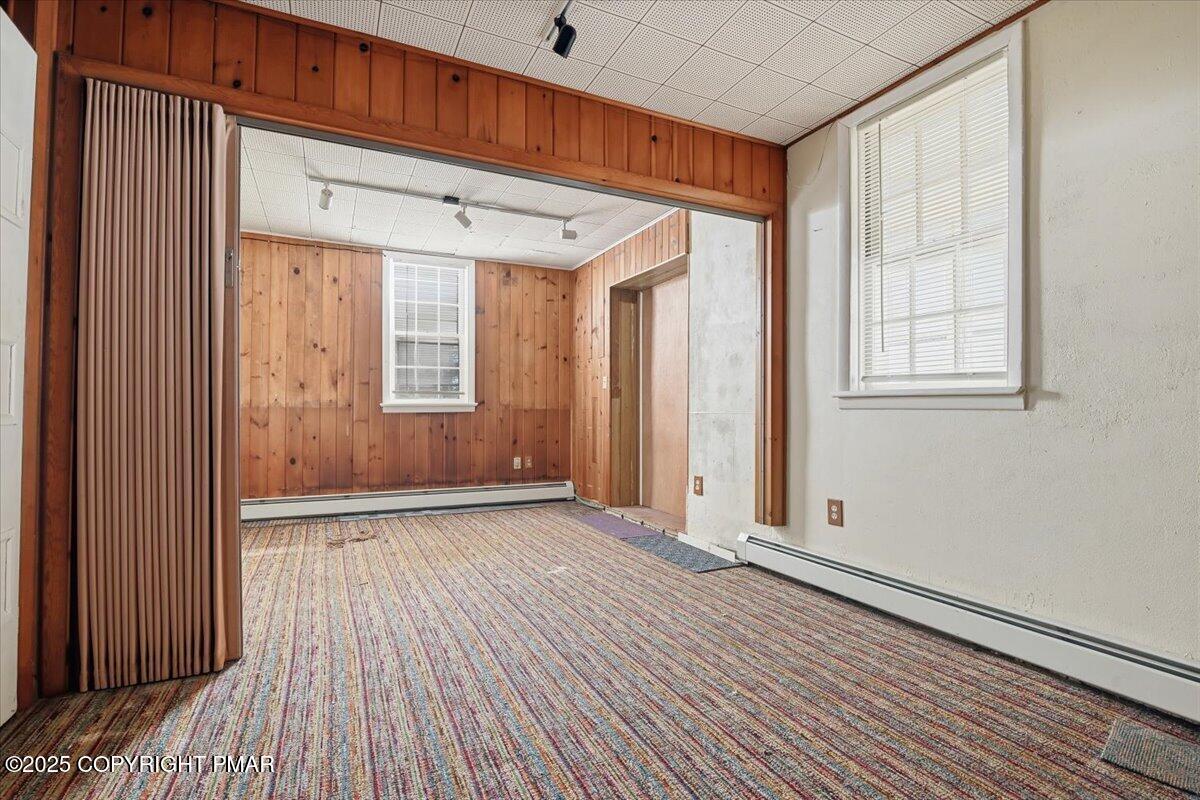 137 Berwick Heights Road East Stroudsburg, PA 18301 - Photo 62 of 88 an empty room with wooden floor and windows