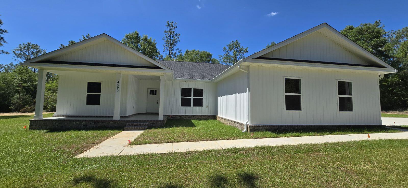4500 Wolf Track Ridge Crestview, FL 32539 - Photo 1 of 19 a front view of a house with a yard