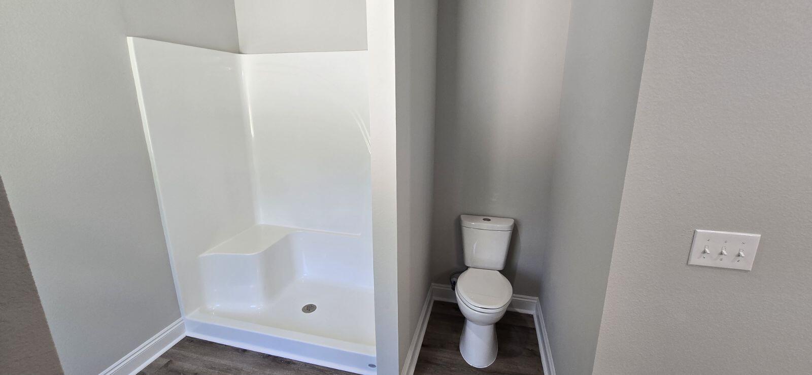 4500 Wolf Track Ridge Crestview, FL 32539 - Photo 13 of 19 a bathroom with a toilet and a mirror