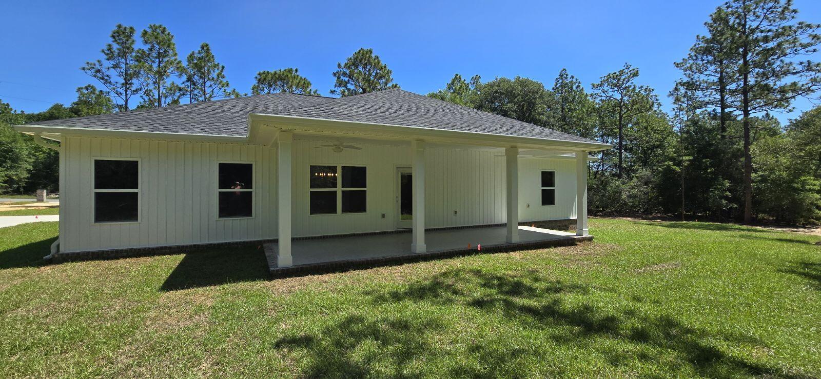 4500 Wolf Track Ridge Crestview, FL 32539 - Photo 3 of 19 a view of a house with backyard and a tree