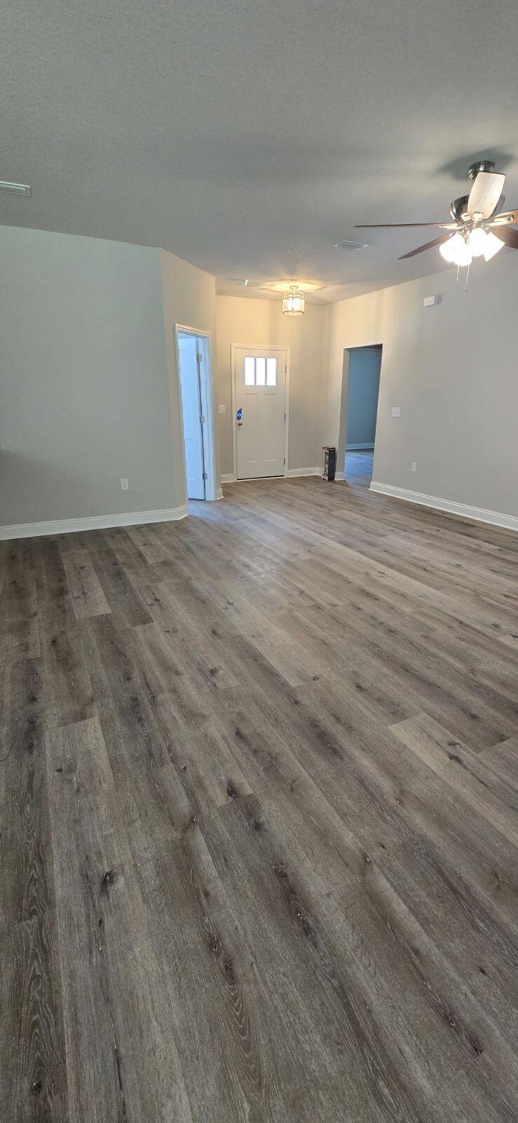 4500 Wolf Track Ridge Crestview, FL 32539 - Photo 6 of 19 a view of empty room with wooden floor