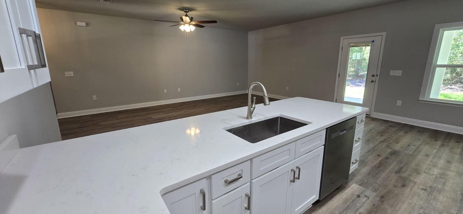 4500 Wolf Track Ridge Crestview, FL 32539 - Photo 7 of 19 a kitchen with a sink and a stove