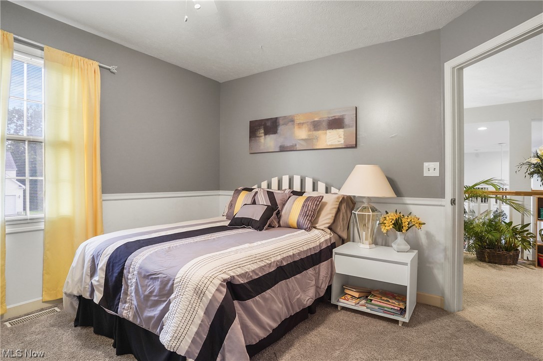 693 Timbercreek Road Northfield, OH 44067 - Photo 12 of 34 Upstairs Carpeted bedroom featuring multiple windows