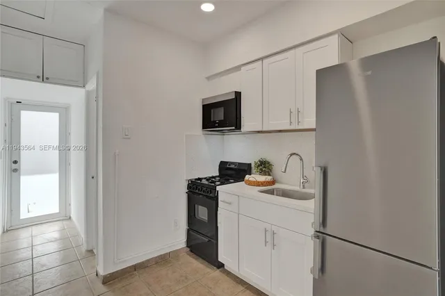 a swimming pool with yard and palm tree