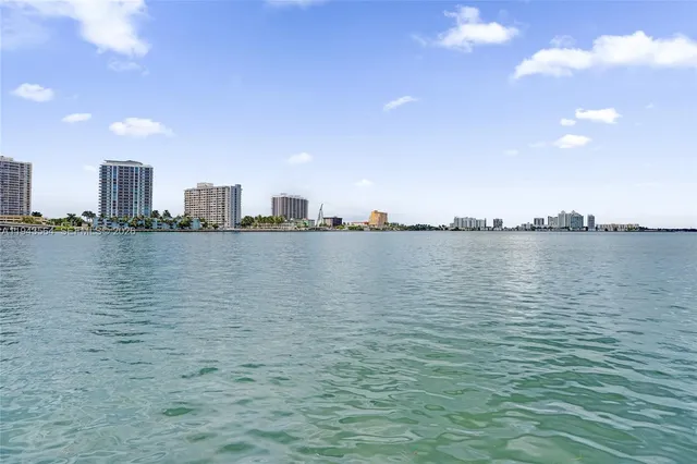a front view of a house with a garden and patio