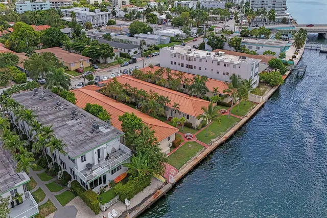a view of an empty room with a ceiling fan and a window