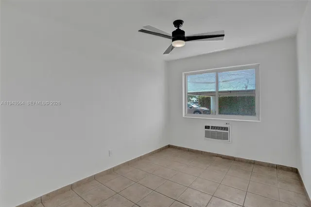 a view of a room with a ceiling fan