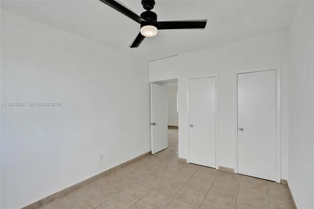 a view of empty room with windows